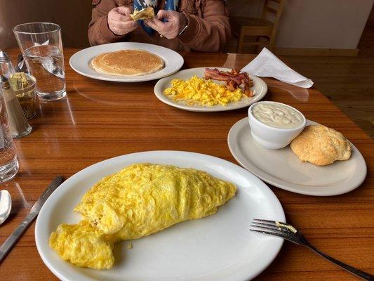 Large omelette with everything. Biscuit and sausage gravy, pancake, scrambled eggs and bacon