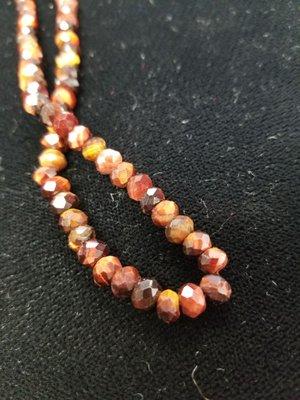 Red tiger eye faceted rondelles.