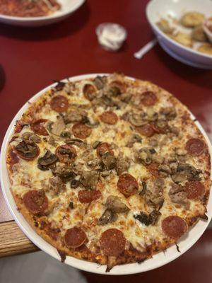 Pepperoni, mushroom sausage flat bread pizza