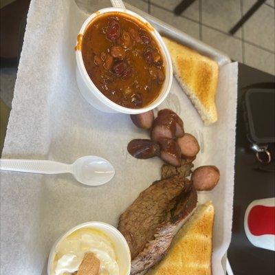 Beef brisket, sausage, beans and banana pudding.