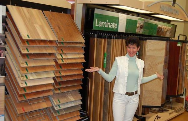 Mrs. Big Bob showing off laminate flooring.