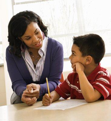 student receiving one-to-one instruction from teacher