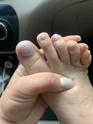 I ended up leaving because she was going to start painting my toe nails looking like this. Look at my big toe and my second toe!