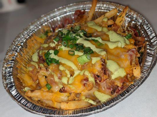 Bacon cheese fries  Ask for extra green sauce on the side.