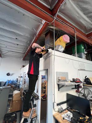 FlyLock Orange County technician installing a security camera for a commercial CCTV system