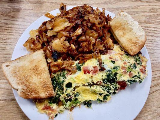 Yummy spinach tomatoe cheese omelette.  I asked for onions on the home fries.