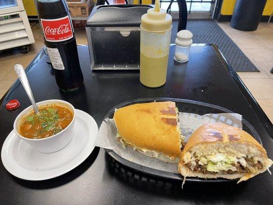 Fajita torta ,  charro beans and a coke