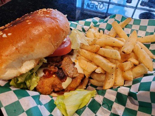 Koko burger! 
A delicious crispy chicken, topped with gyros, tomatoes, lettuce and spicy mayo!