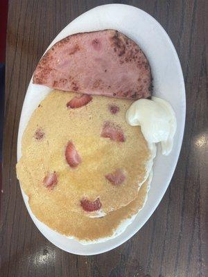 Kid's strawberry pancakes with ham.