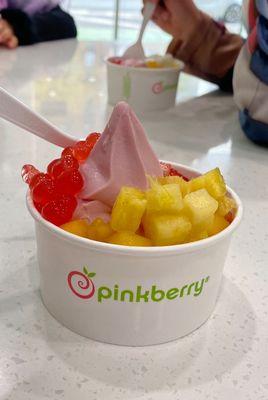 Pomegranate frozen yogurt with fruits and strawberry burst bubbles