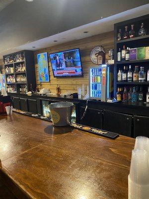 Fully stocked bar with TVs