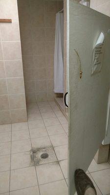 No lock on stall. Sewage backs up in showers and bathroom floor.