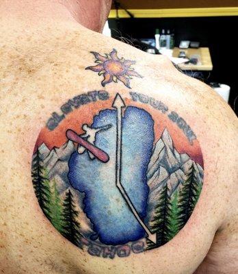 Re-color of my 10 year old tattoo with added mountains and trees. The writing was not retouched as the original was to poor to preserve.