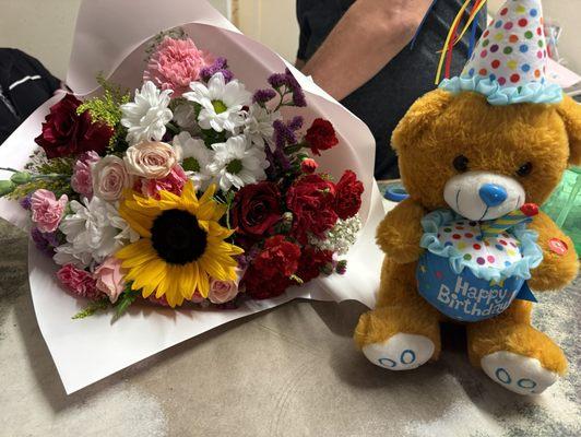 Flower bouquet and bear.