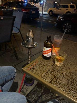 Outside seating area with hookah.