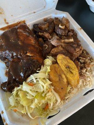 Jerk chicken, oxtail, rice & peas, cabbage, and plantains