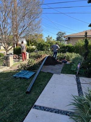 Digging in yard to get to damaged plumbing