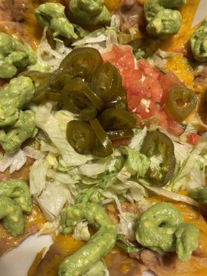 Nachos bean and cheese (avocado/guacamole on them was from home)