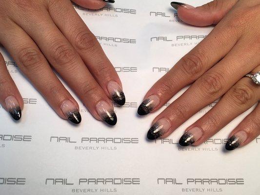 Acrylic nails with gel overlays.