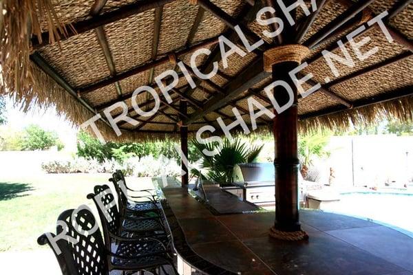 For this project, we core-drilled the existing bar, and fitted a custom oval Palapa.