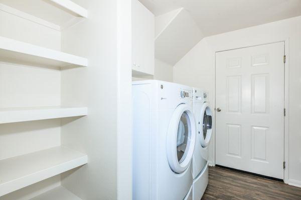 Pegasus upgraded front loading washer/dryer in designated space