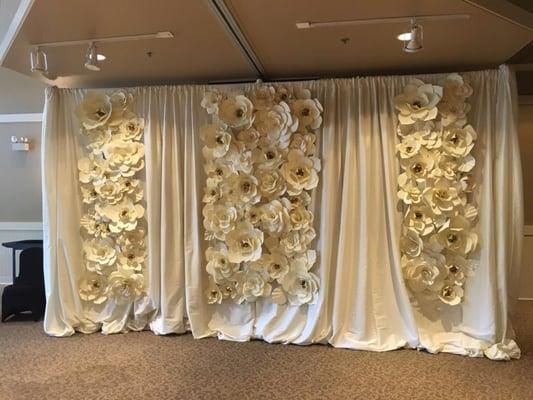 Rented backdrop frame and curtains. We made the flowers and attached them