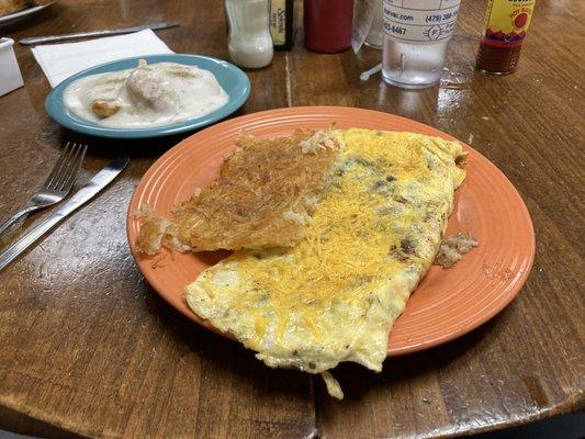 Spanish omelet, hash browns, and a side of biscuits and gravy