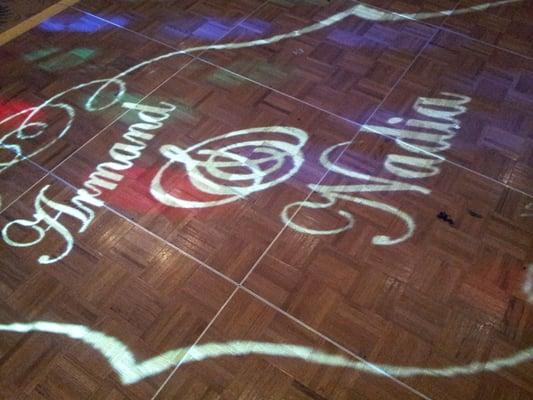 See your name in lights! We offer monogram projection on walls or dance floors!