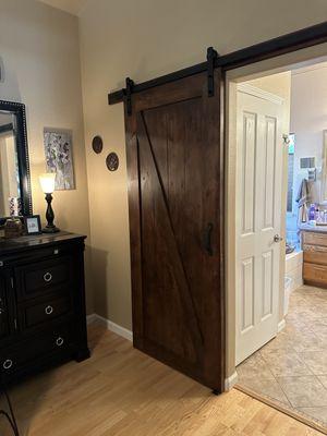 Install barn door.