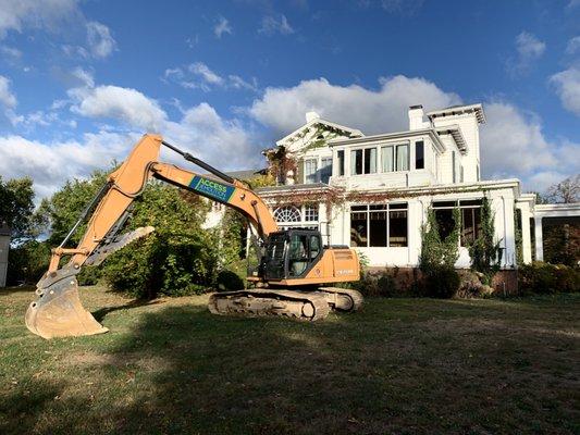 Access Demolition excavator before tearing down this out of use funeral home