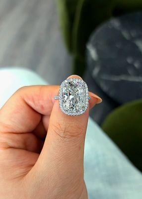 Elongated Cushion cut diamond on our custom GB ultra thin halo and pave shank