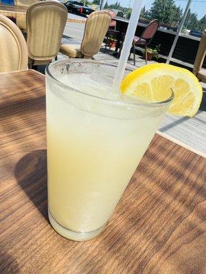 Ice cold lemonade in a frosted glass. The real stuff the good stuff.