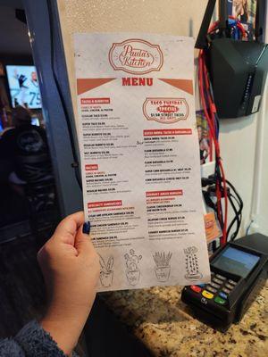 Food menu. You order yourself at the little window as they are independent from the bar.