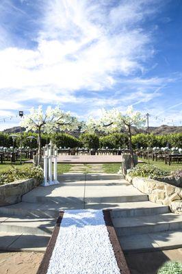 Enchanted tree and rose petal aisle runner rentals!