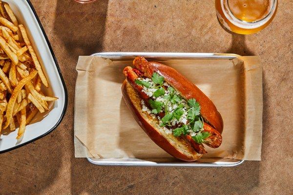 Smoked Chicken Chorizo Sandwich, onion puree, pickled peppers, queso fresco, cilantro