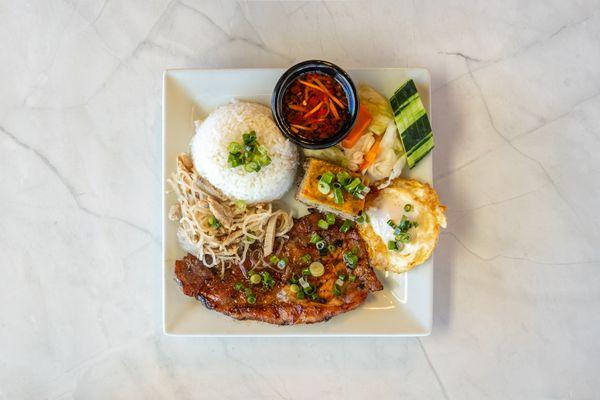 Grilled Pork, shredded pork, egg cake, fried egg served with steam rice, cucumber. sour pickles and side of fish sauce!!