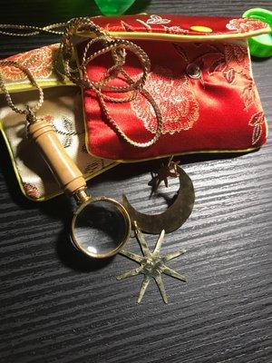 Silk gift bags, magnifying glass necklace, brass moon& star earrings.