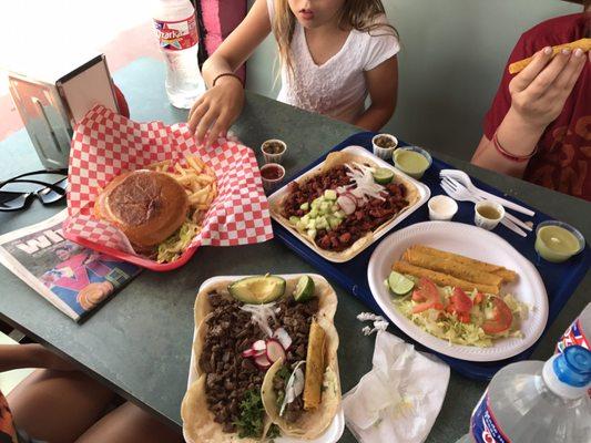 Flautas, carne asada and pastor tacos. And a hamburger. The flautas are