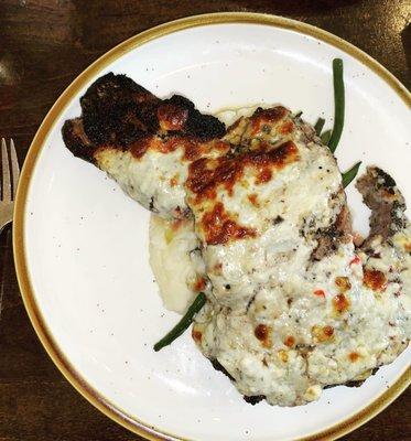 Mashed potatoes, green beans, choice Ribeye with blue cheese on top.