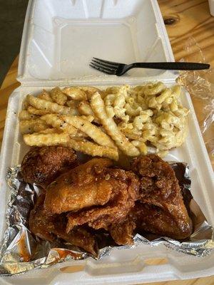 Chicken wings, garlic fries, and Mac and cheese