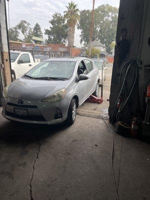 Toyota Prius getting new tires and brake service.