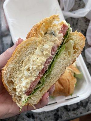 Egg salad sandwich on a croissant