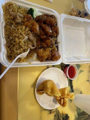 Lunch special orange chicken, includes chicken fried rice and 2 crab rangoon.