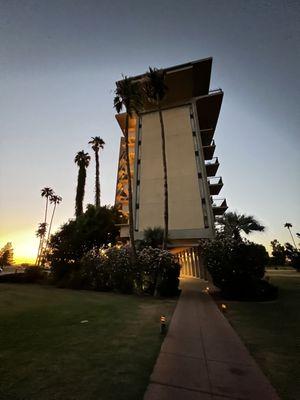 A hotel in an oasis in the middle of the desert.