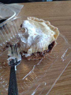 Half eaten banana cream & chocolate pie slice $5.25