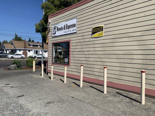 Building side and sign facing the parking area.