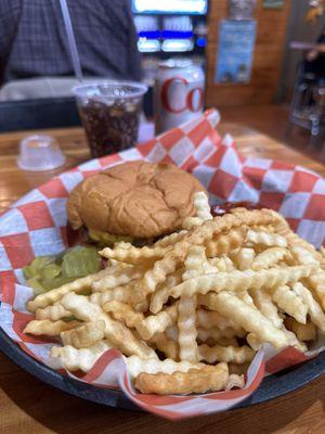 Cheeseburger with side of fries and extra pickles . Soda came in a can .