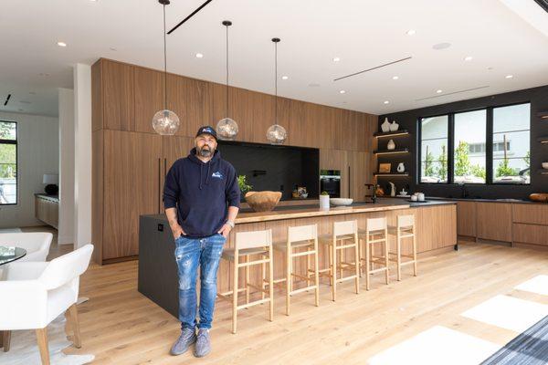 Home remodeling by Eli Alon - kitchen area whit new island, light fixture,  flooring