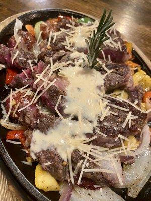 Ribeye on a skillet w/garlic butter