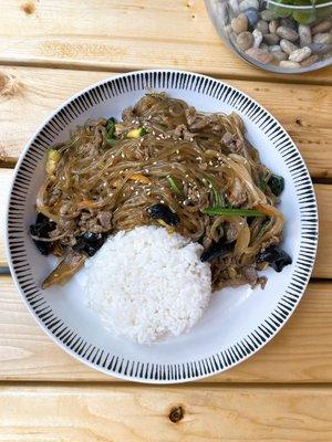 Stir-fried glass noodles with mixed vegetables seasoned with soy sauce and sesame oil. Choice of bulgogi beef or tofu.